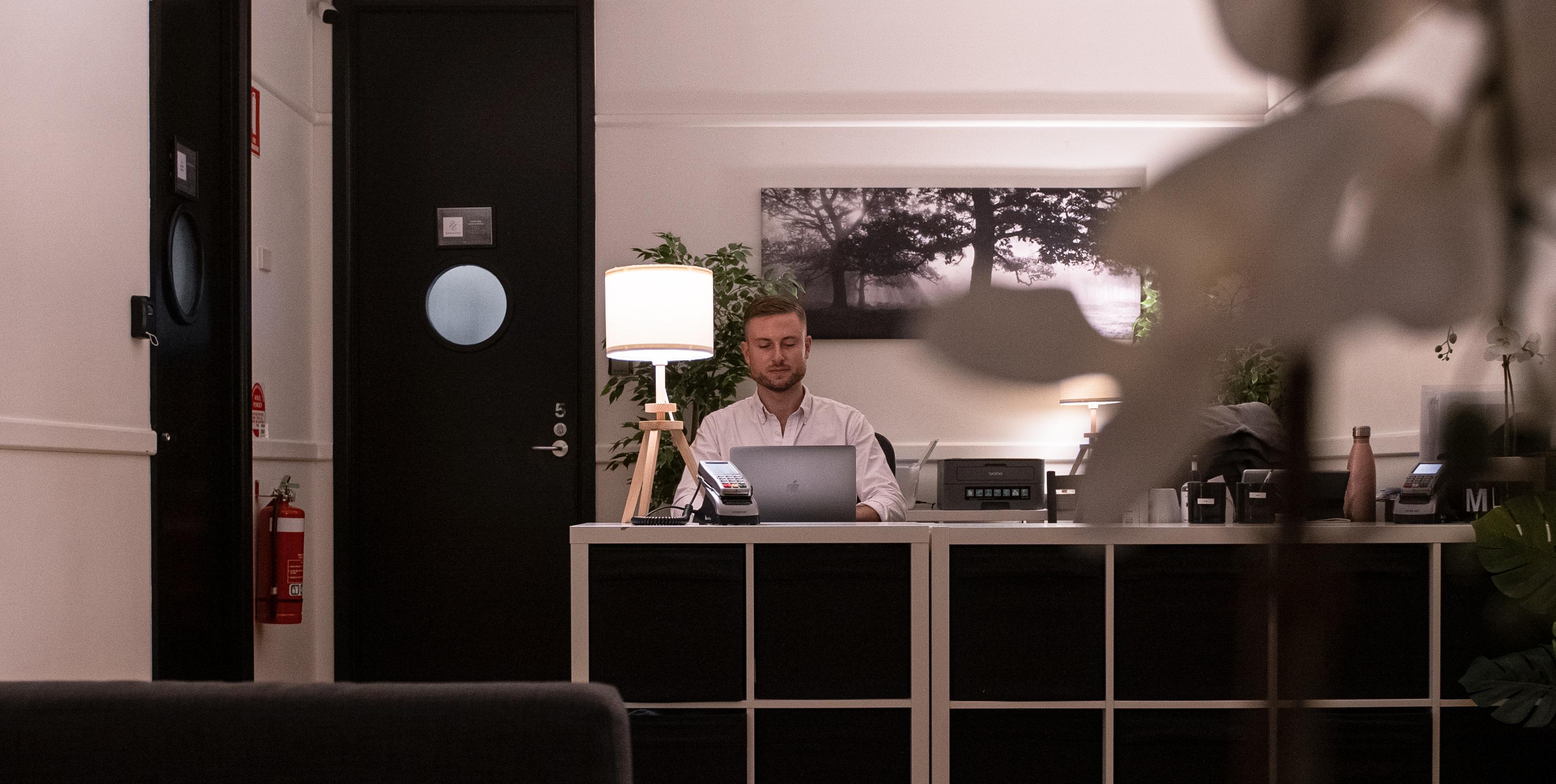 Michael working at his clinic desk